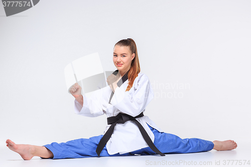 Image of The karate girl with black belt 