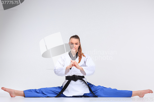 Image of The karate girl with black belt 