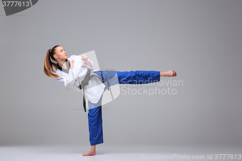 Image of The karate girl with black belt 