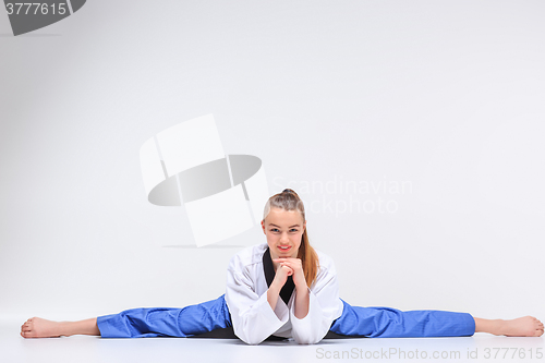 Image of The karate girl with black belt 