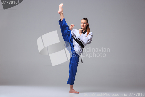 Image of The karate girl with black belt 