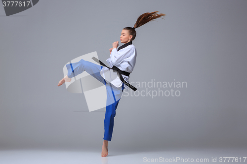 Image of The karate girl with black belt 