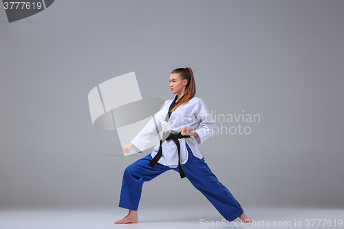 Image of The karate girl with black belt 