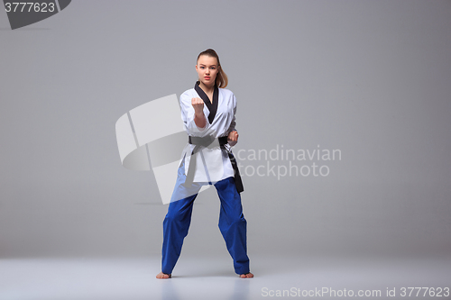 Image of The karate girl with black belt 