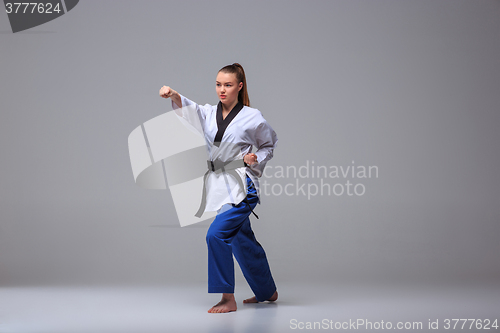 Image of The karate girl with black belt 