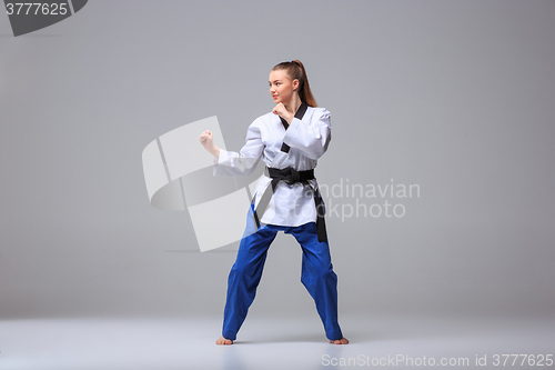 Image of The karate girl with black belt 