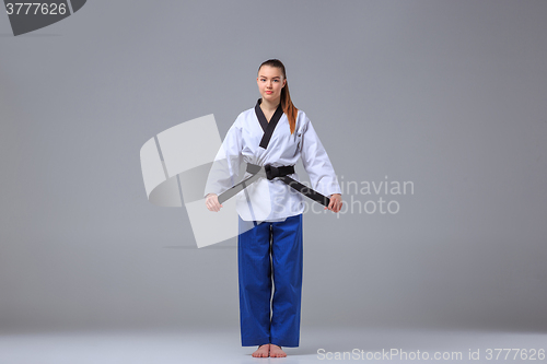 Image of The karate girl with black belt 