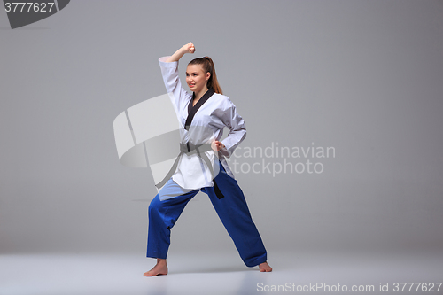 Image of The karate girl with black belt 