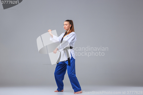 Image of The karate girl with black belt 