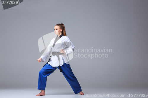 Image of The karate girl with black belt 