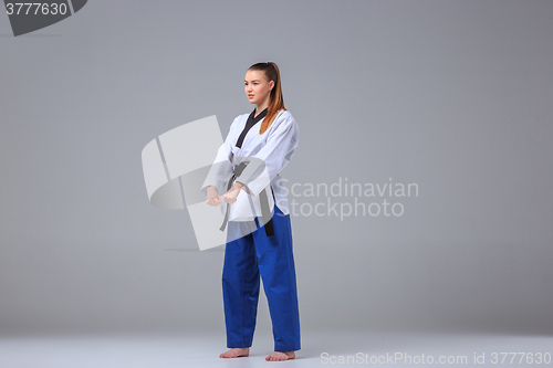 Image of The karate girl with black belt 