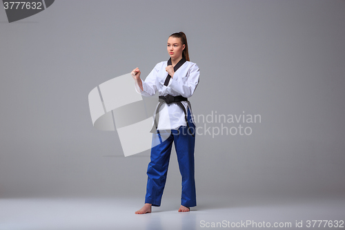 Image of The karate girl with black belt 