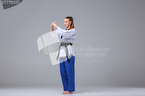 Image of The karate girl with black belt 