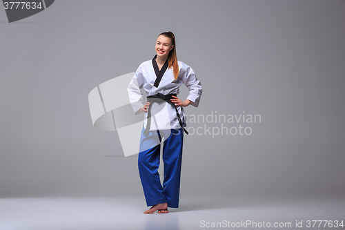 Image of The karate girl with black belt 