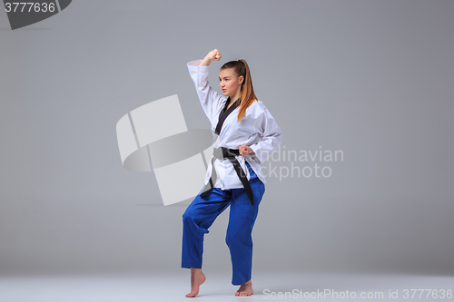 Image of The karate girl with black belt 