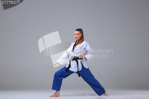 Image of The karate girl with black belt 