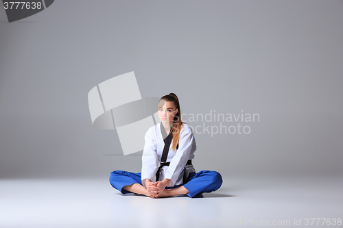 Image of The karate girl with black belt 