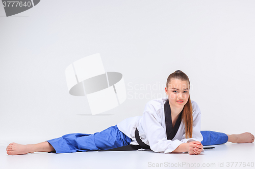 Image of The karate girl with black belt 