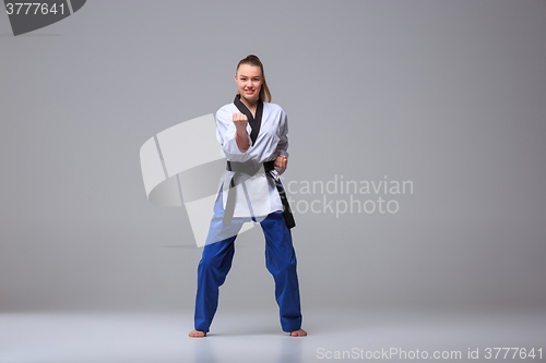 Image of The karate girl with black belt 