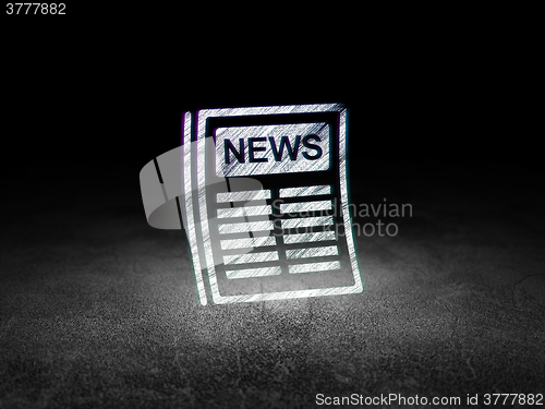 Image of News concept: Newspaper in grunge dark room