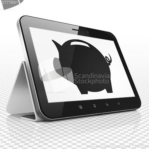 Image of Banking concept: Tablet Computer with Money Box on display
