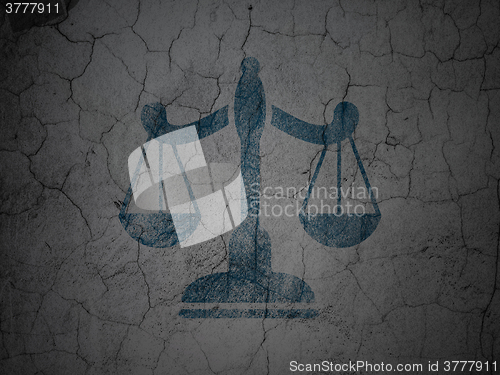 Image of Law concept: Scales on grunge wall background