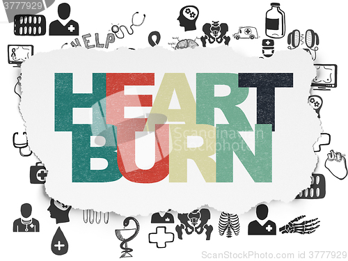 Image of Medicine concept: Heartburn on Torn Paper background