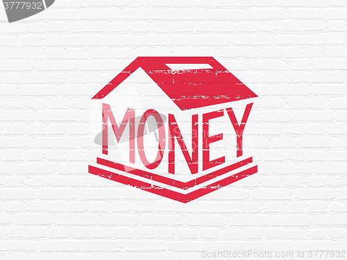 Image of Currency concept: Money Box on wall background