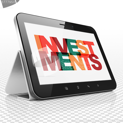 Image of Money concept: Tablet Computer with Investments on  display
