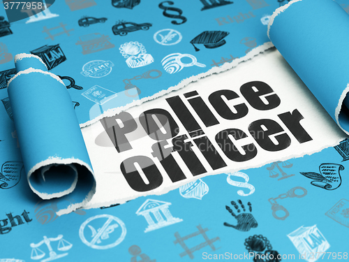 Image of Law concept: black text Police Officer under the piece of  torn paper