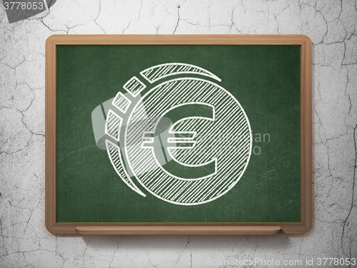 Image of Banking concept: Euro Coin on chalkboard background