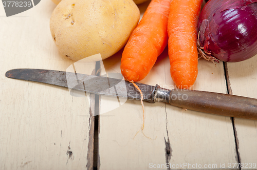 Image of basic vegetable ingredients carrot potato onion 