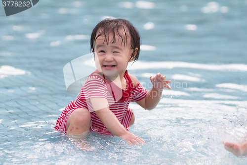 Image of Chinese Little Girl Playing in Water