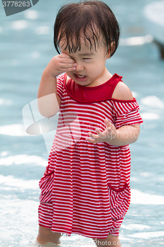 Image of Chinese Little Girl Playing in Water