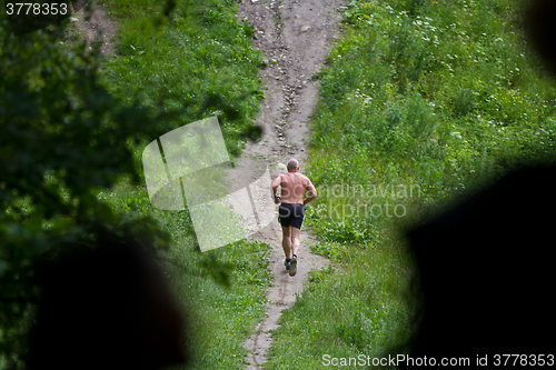 Image of Man running in a Forest