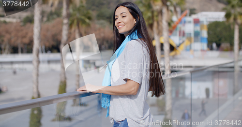 Image of Beautiful young smiling woman at overlook