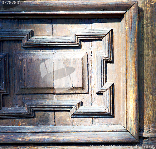 Image of   blur   abstract   rusty brass brown knocker in a  door curch  
