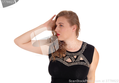 Image of Closeup of woman with hand on head.