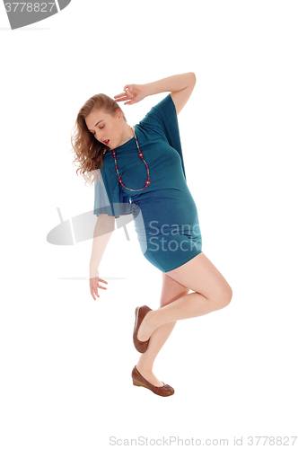 Image of Woman dancing, looking down.