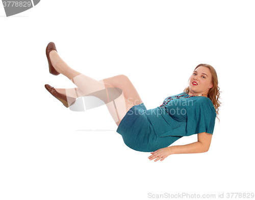 Image of Blond woman lying on floor.