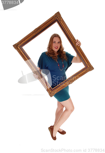 Image of Woman holding a  picture frame.