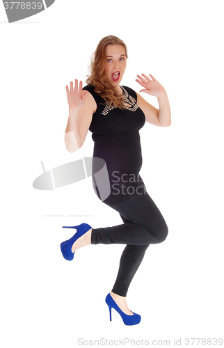 Image of Woman dancing in black tights.