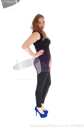 Image of Woman standing in black tights.