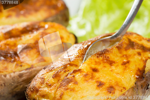 Image of baked potatoes whole in their skins 