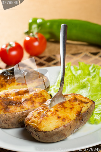 Image of baked potatoes whole in their skins 