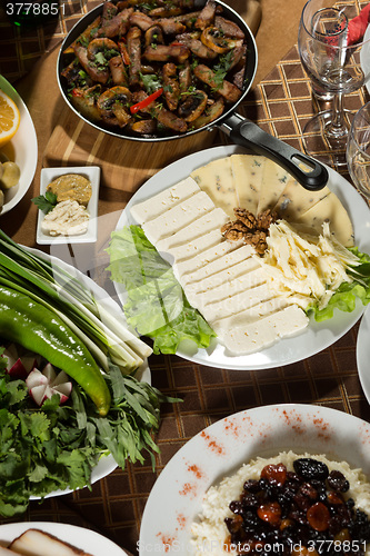 Image of table with normal food, steaks and potatoes. 