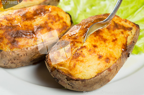 Image of baked potatoes whole in their skins 