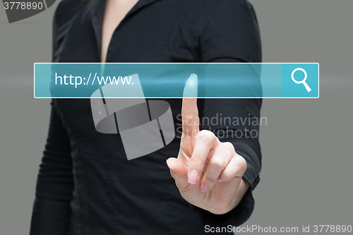 Image of Young woman touching web browser address bar with www sign