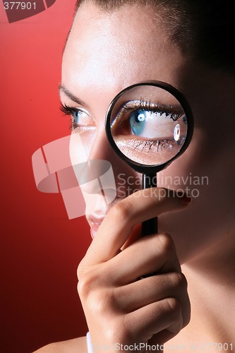 Image of blu eyes with magnifier