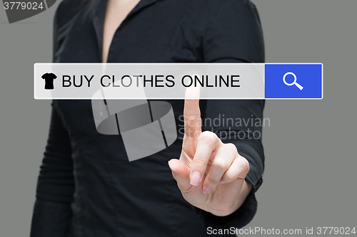 Image of girl clicks on virtual screens - buy online clothes